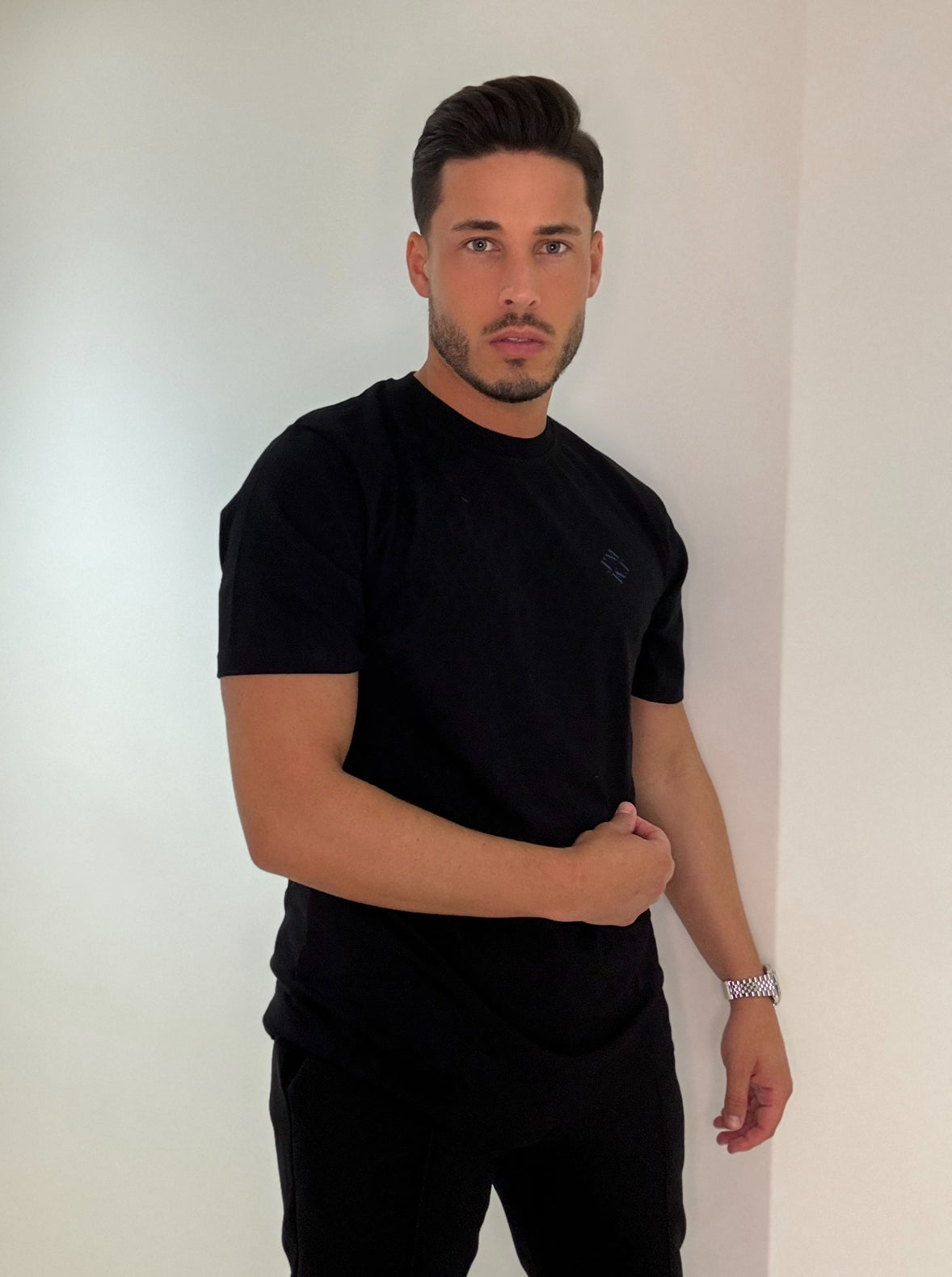 Effortless Edge: Mastering Minimalism in All-Black Style